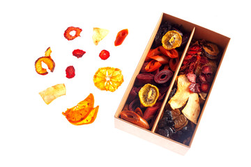 Box with marshmallow and dried fruit on a white background