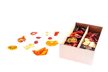 Box with marshmallow and dried fruit on a white background