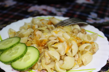 photo plates of noodles with meat,cabbage,carrots,cucumber