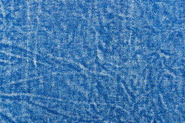 Blue washed faded jeans texture with seams
