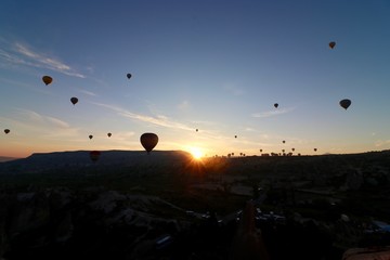 Hot air balloons over Goreme, Turkey, during sunrise.