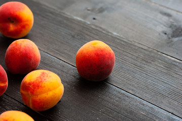 peaches on black wood table