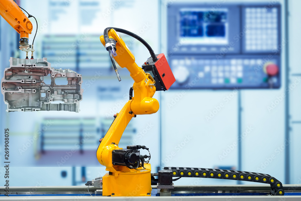 Poster moving welding robot and robot gripping working with engine parts of motorbike on blurred smart fact