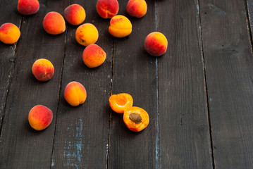 Fototapeta na wymiar peaches on black wood table