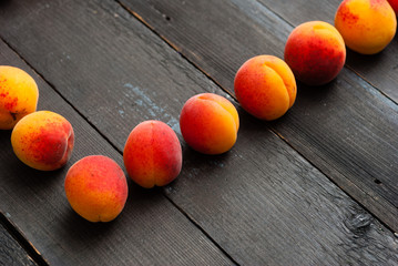 peaches on black wood table
