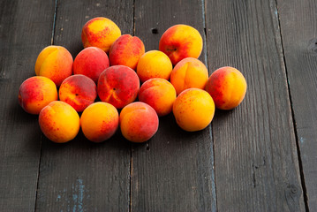 peaches on black wood table