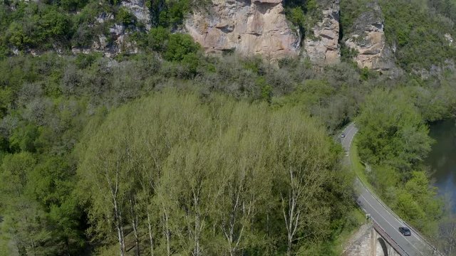 From top to down a aerial view of Bruniquel Castle, Occitanie, France. The castle was a location for the 1975 film Le Vieux Fusil.