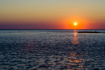 Amazing sea sunset, the sun, waves, clouds