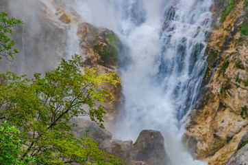 Fototapeta na wymiar Big waterfall in Julian Alps.