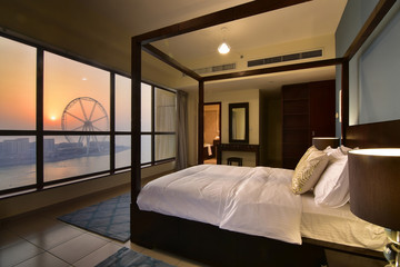 Elegant Bedroom of a High Rise Apartment in Dubai Overlooking Marina © laphotography