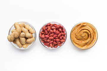Bowls with peanuts and peanut butter