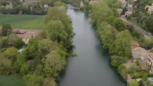 Over Orb river of Beziers with old arch bridge as background