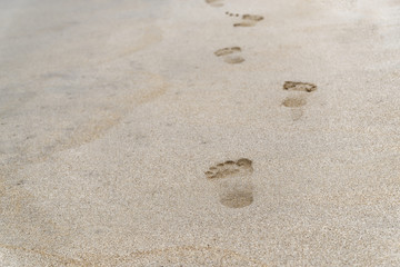 Beach scene of footprints in a sand