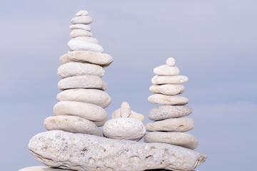 Fototapeta na wymiar Relax nature concept stack of white pebbles stone against sea background for spa balance meditation and zen theme