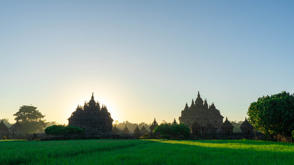 the view of the sunrise in a village with a plaosan buddhist temple background in Yogyakarta, Indonesia