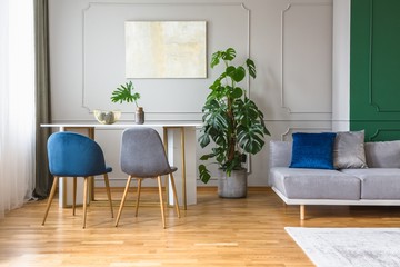 living and dining room with blue and grey decorations