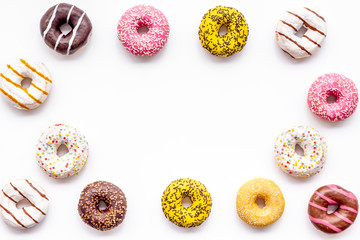 Traditional american donuts of different flavors frame on white background flat lay mockup