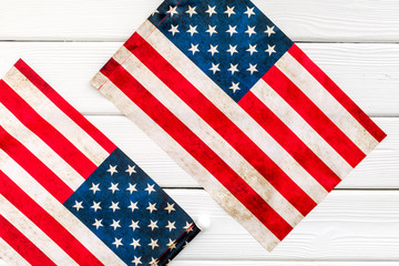 Fototapeta premium Independence day of USA with flag on white wooden background top view