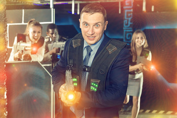 Man holding laser gun and playing laser tag