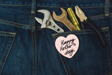Repair tool in the back pocket of jeans and congratulations on Father's Day