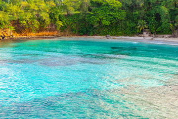 Beautiful aerial/ drone view of scenic tropical island beach summer holiday setting. Turquoise...