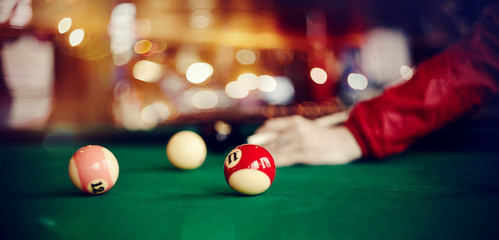 Colorful billiard balls on a billiard table.
