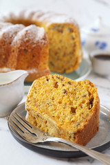 Homemade carrot bundt cake with walnuts and cup of coffee