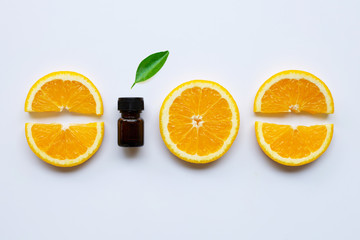 Orange essential oil with fresh orange citrus fruit