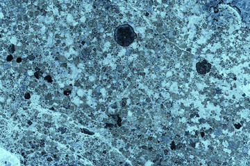 Vintage blue background. Rough painted wall of sapphire color. Imperfect plane of blue colored. Uneven old decorative toned backdrop of cyan tint. Texture of sapphirine hue. Ornamental stony surface.