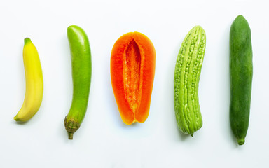 Banana, green long eggplant, ripe papaya, bitter melon,  green papaya on white background.