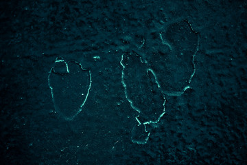 Vintage azure background. Rough painted wall of turquoise color. Imperfect plane of cyan colored. Uneven old decorative toned backdrop of aqzure tint. Texture of teal hue. Ornamental stony surface.