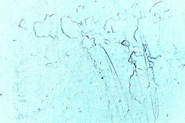 Vintage blue background. Rough painted wall of sapphire color. Imperfect plane of blue colored. Uneven old decorative toned backdrop of cyan tint. Texture of sapphirine hue. Ornamental stony surface.