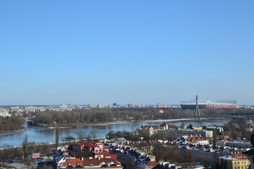 Obraz premium Warsaw, Poland. Cityscape of Warsaw with Slasko-Dabrowski Bridge and Vistula river, aerial view from the bell tower of the St. Anne church. W-Z route