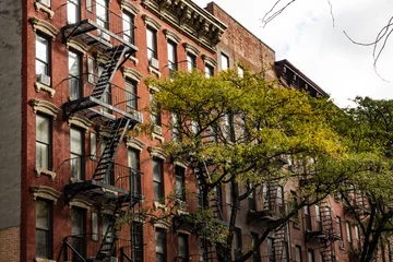 Tuinposter Close-up view of New York City style apartment buildings with emergency stairs along Mott Street in Chinatown neighborhood of Manhattan, New York, United States. © Travel Wild