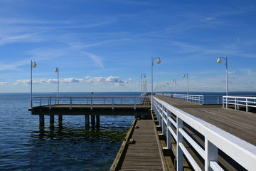 Wooden pier in Jurata town at sunny, summer day. Coast of Baltic Sea at Hel peninsula, Poland