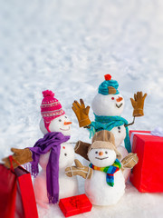 Snowmen family - gift presents concept. Winter Sale banner. New year gift. Santa Claus gifting gift. Christmas snowman with shopping bag and Christmas gift.