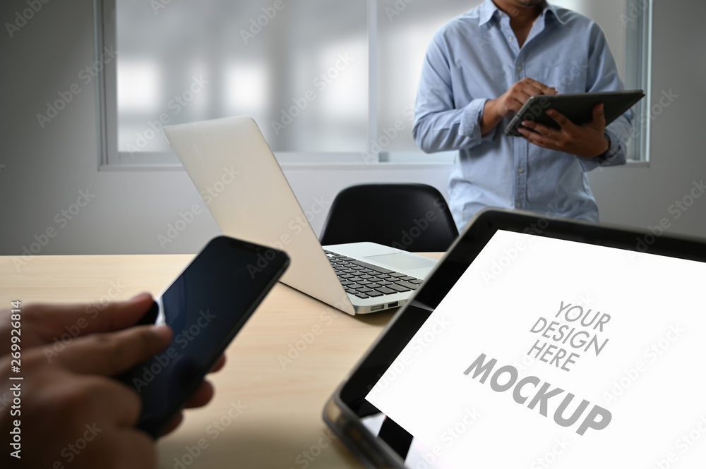 Poster mockup image of business laptop with blank screen on table blank copy space screen for your advertis