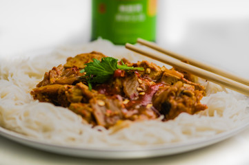 Kimchi stew with tofu and pork, on rice noodles