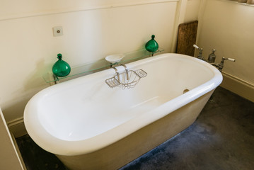 Victorian style 'rolltop' bath in an old fashioned bathroom