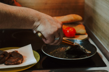 Making dinner in restaurant. Professional cooker
