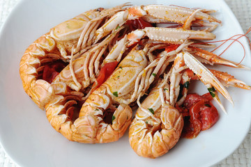 Scampi cooked with cherry tomato sauce