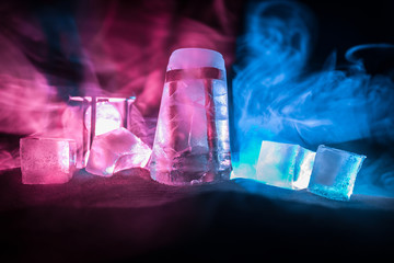 Silhouette hourglass is disintegrating on hand Pocket watch at last sunlight (Concept of wasting time)