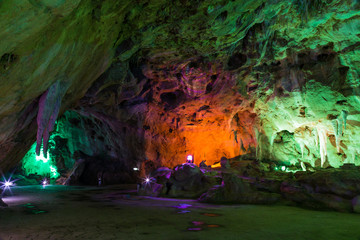 Fototapeta na wymiar Inside Karst cave, there were colored lights