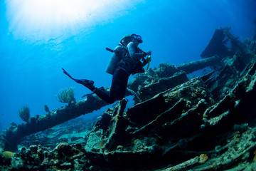 A diver exploring the Rhone wreck