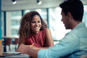 Image of two young businessmen at meeting