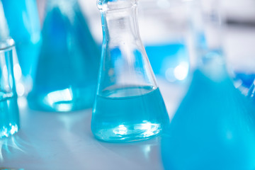 Chemical laboratory equipment Glassware for research and blue matter