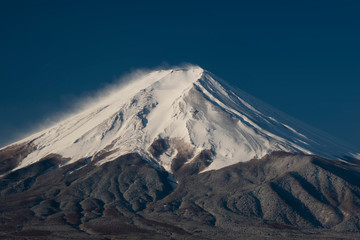 Mount Fuji on close-up with a town below, Japan