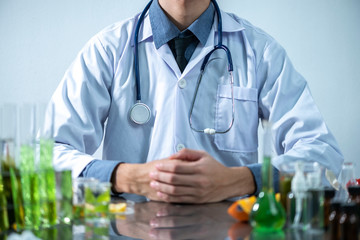 The scientist test the natural product extract, oil and biofuel solution, in the chemistry laboratory.