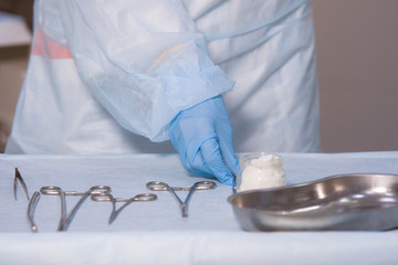 Nurse preparing tools.