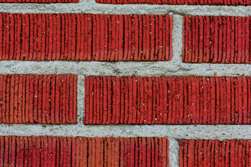 Detail shot of a red brick wall. Brick wall close up. Macro shot of a red brick wall. Red brick wall.